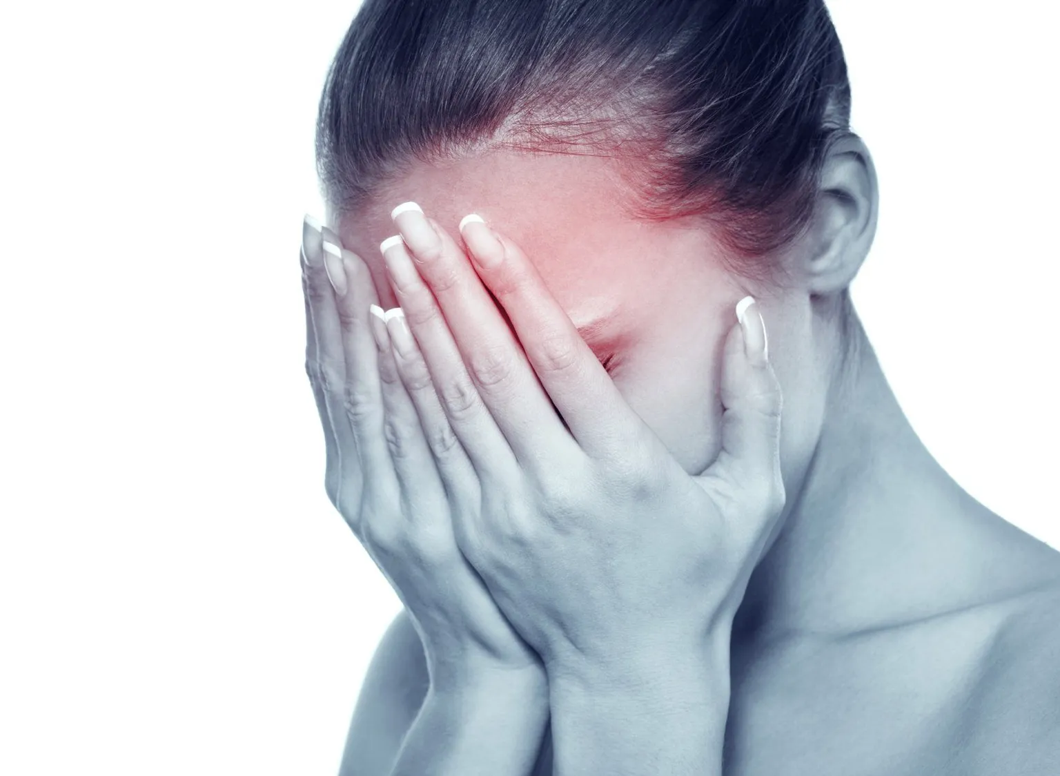 A person covering their face, suggesting sleeplessness and mental fatigue